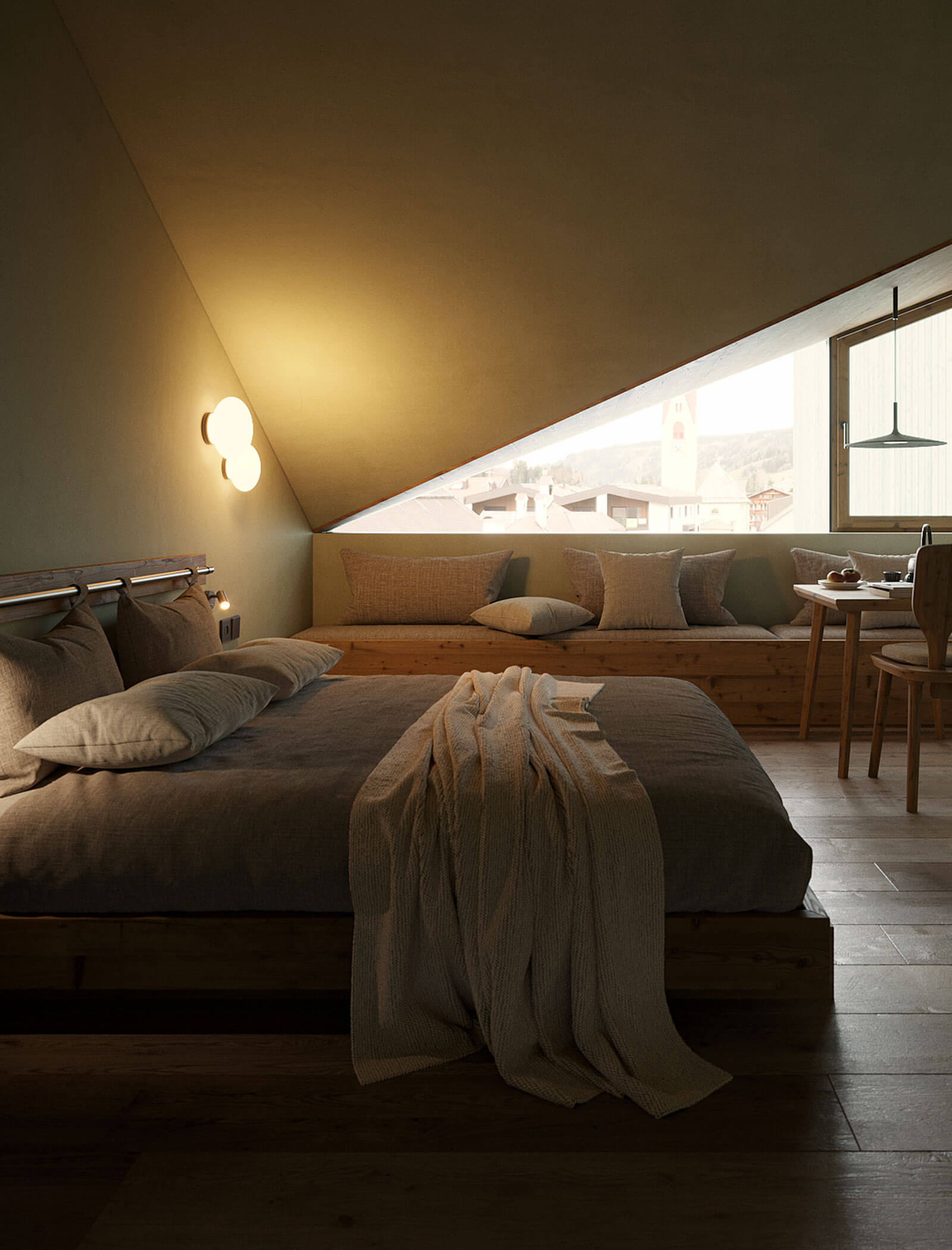 Gemütliches Schlafzimmer im Dachgeschoss mit schräger Decke, sanfter Beleuchtung, einem großen Bett und einem Fensterplatz mit Blick auf die Dächer. - Ansitz Toldt Dolomites Village