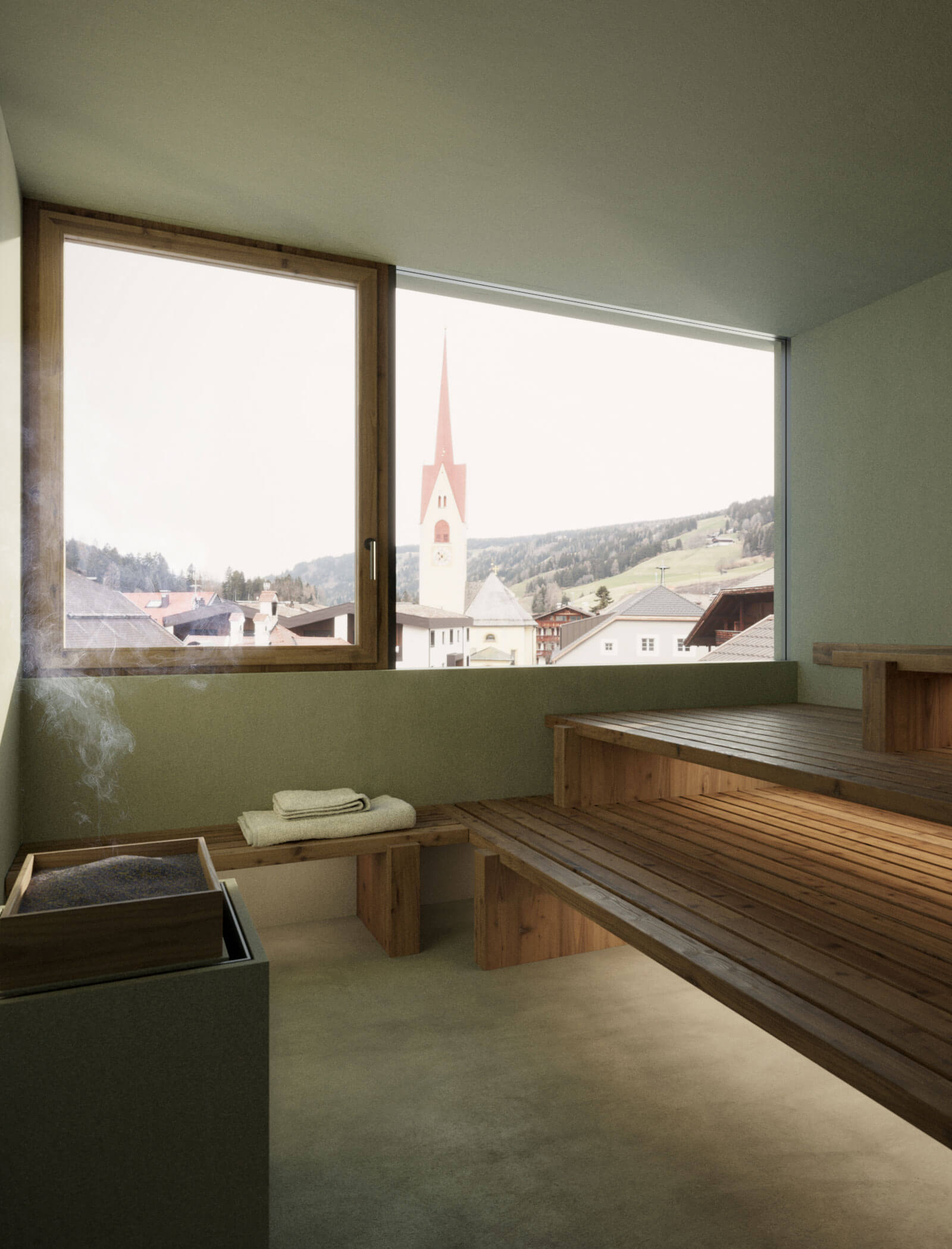 Moderne Saunakabine mit Holzbänken, Handtuch und Blick aus dem Fenster auf eine Stadt mit einem Kirchturm. - Ansitz Toldt Dolomites Village